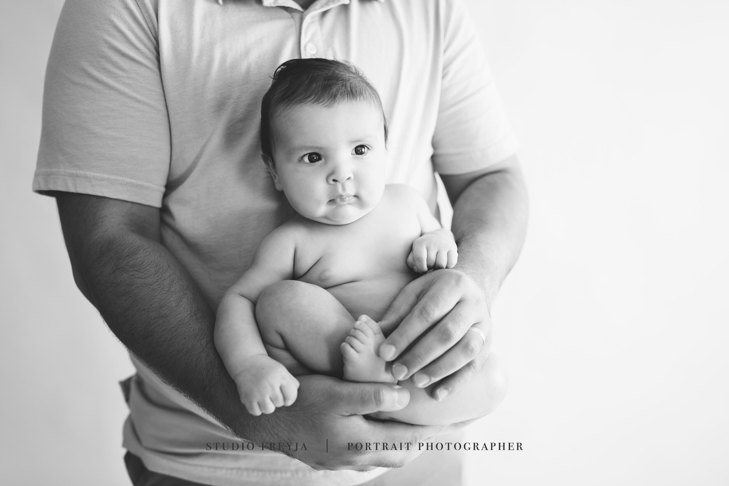 Baby and Daddy Pose in San Diego Newborn Studio