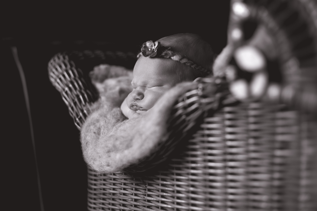 BW Newborn Image in 100 year old buggy by Newborn Photographer in San Diego CA