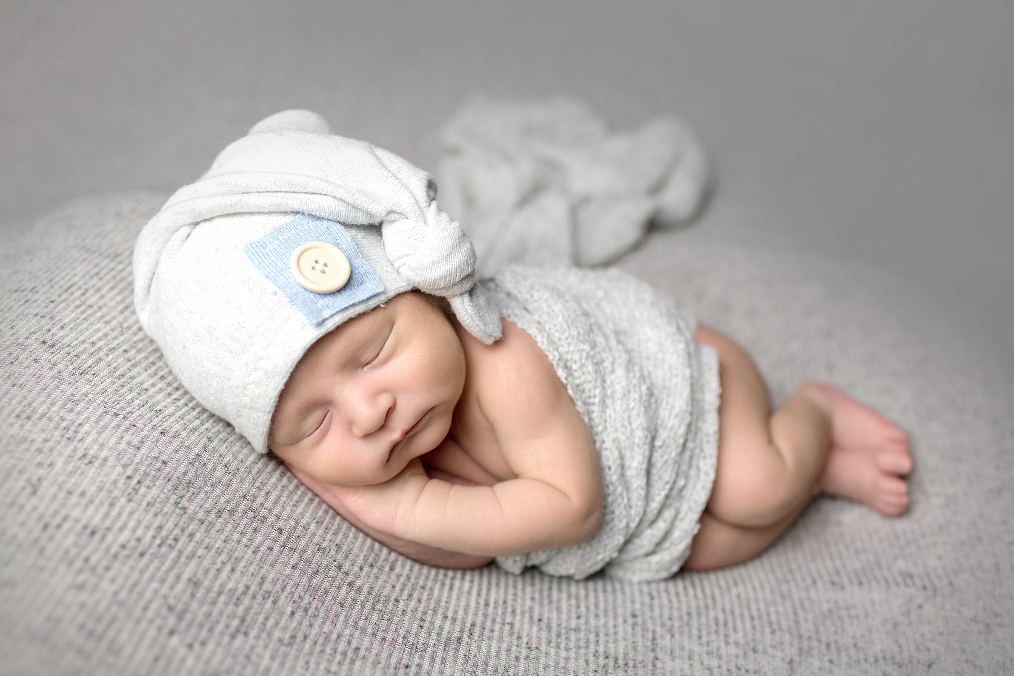 Leo Newborn Photography Session by San Diego Newborn Photographer utilizing sleepy cap