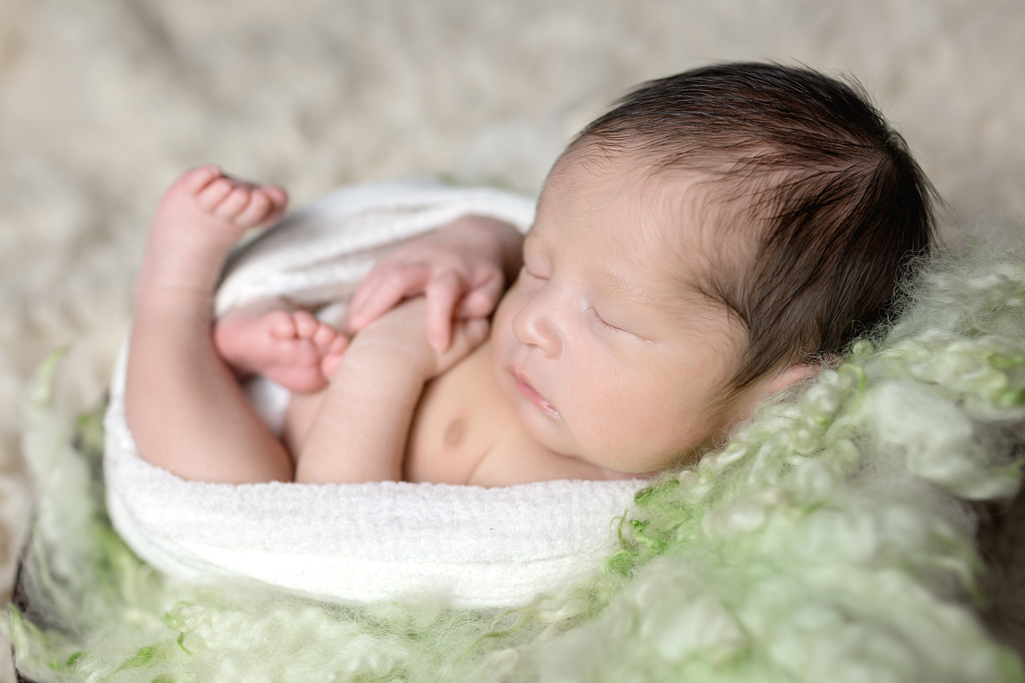 Side Angle Wrapped Leo Newborn Photography Session by San Diego Newborn Photographer