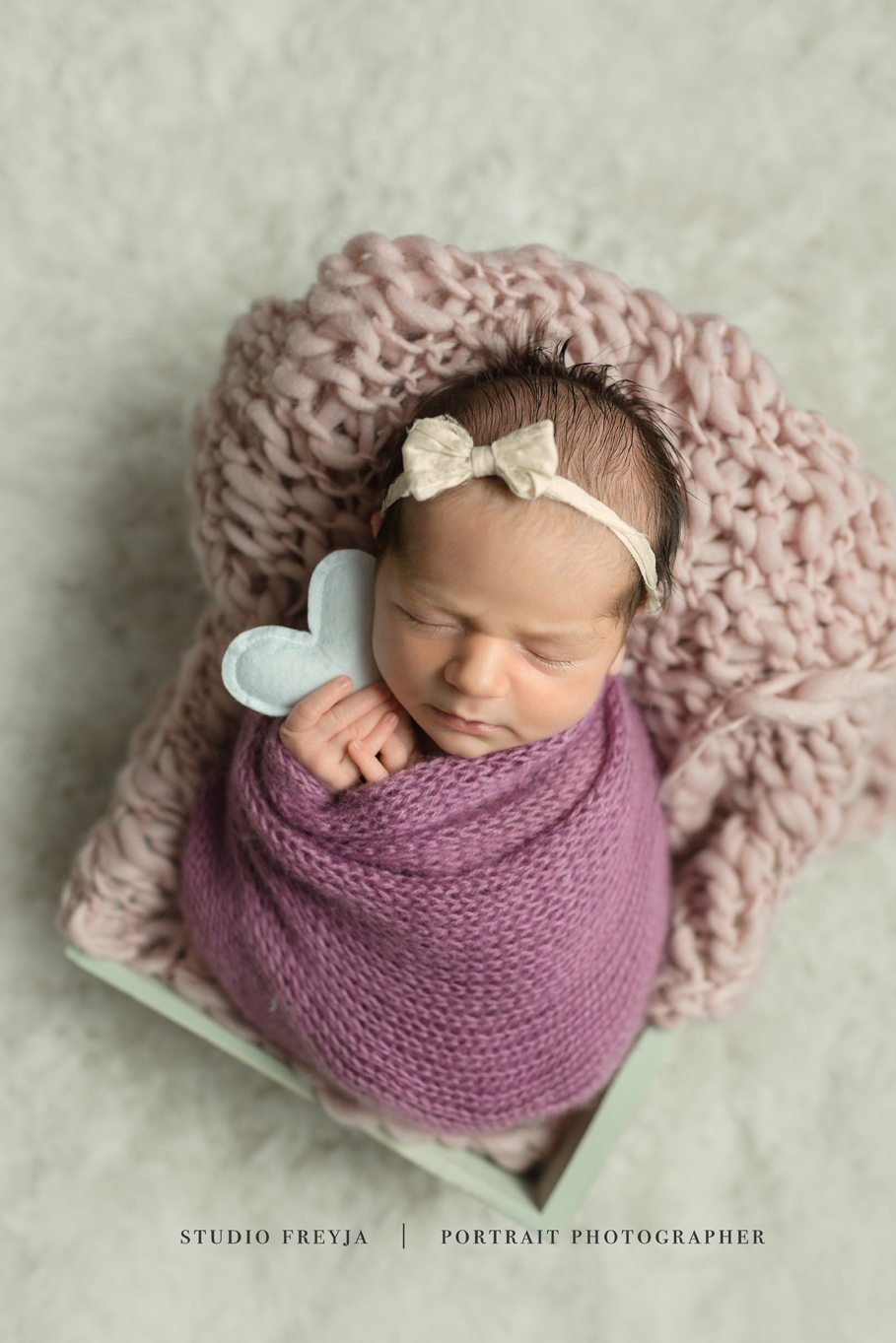 Holding Heart from Target San Diego Newborn Photographer 