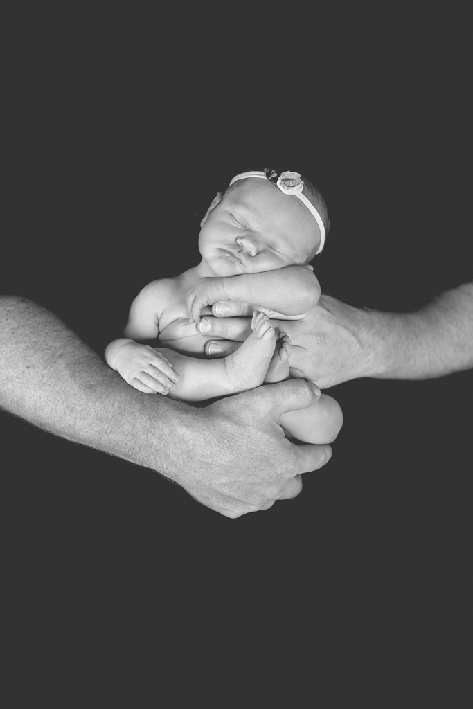 BW Newborn Picture in San Diego CA Parent Posing Dad Holding Baby Girl