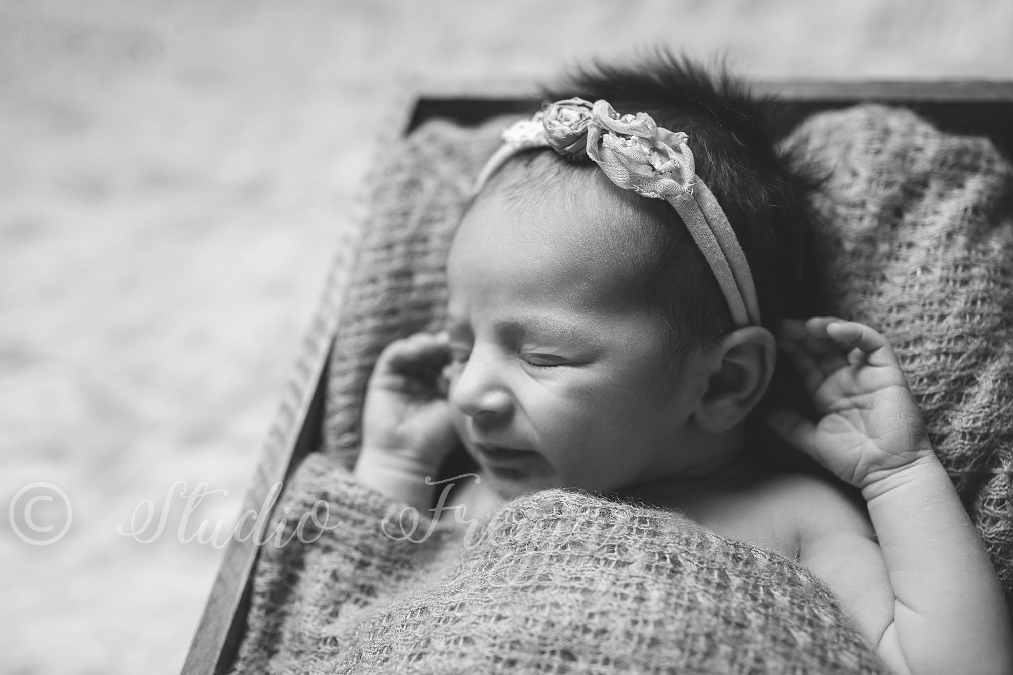 Black and White fine art newborn picture of baby girl by Studio Freyja a San Diego Newborn Photographer 