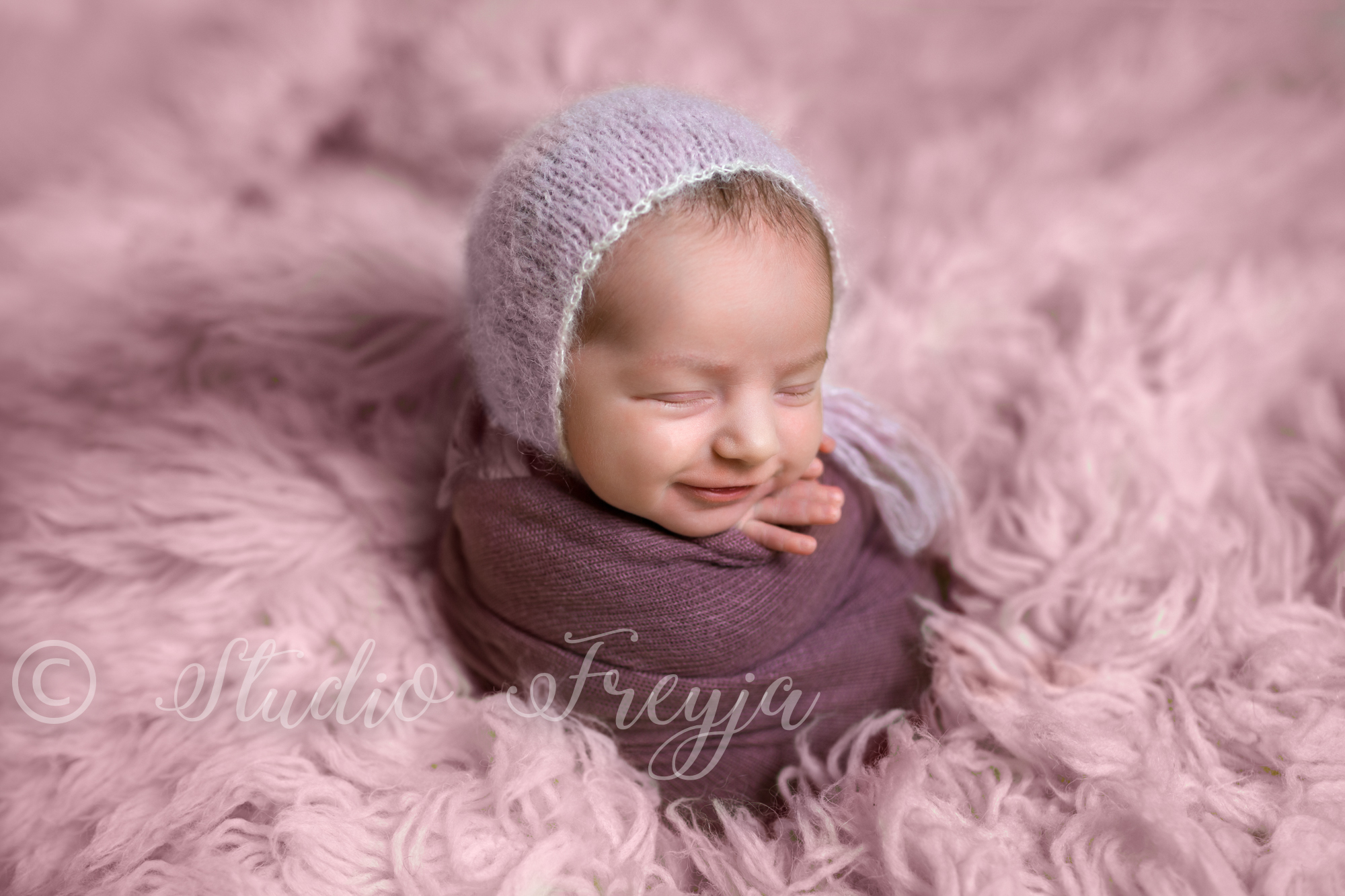 Smiling baby girl during San Diego Newborn Picture Session by Studio Freyja