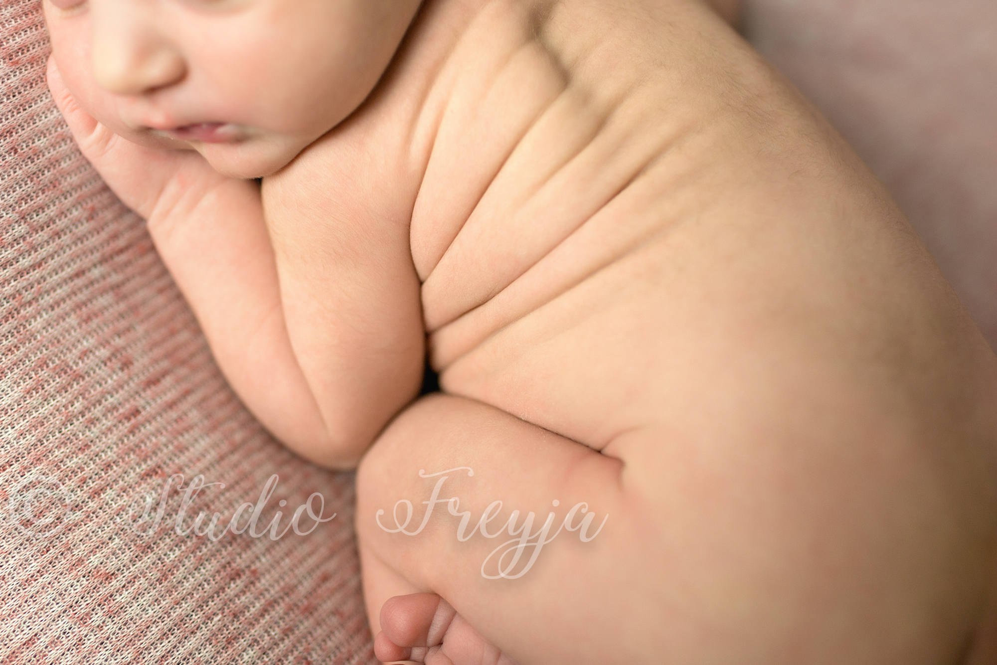 Newborn Girl Rolls in Bum up pose by San Diego Newborn Photographer Studio Freyja