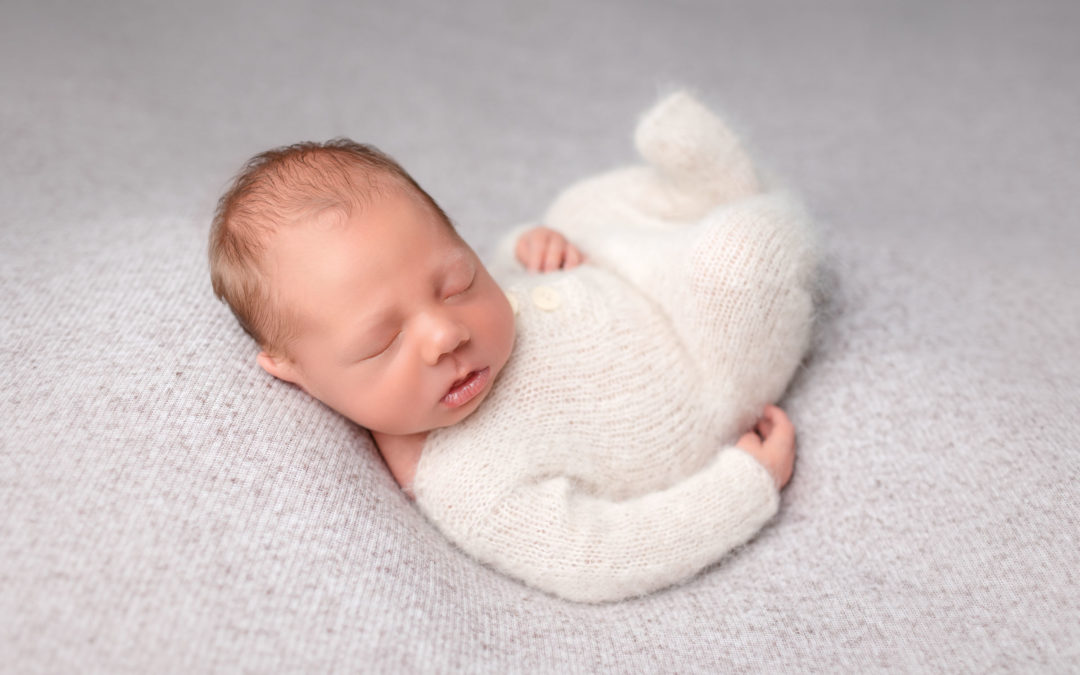 Relaxed on back newborn pose by San Diego Newborn Photographer