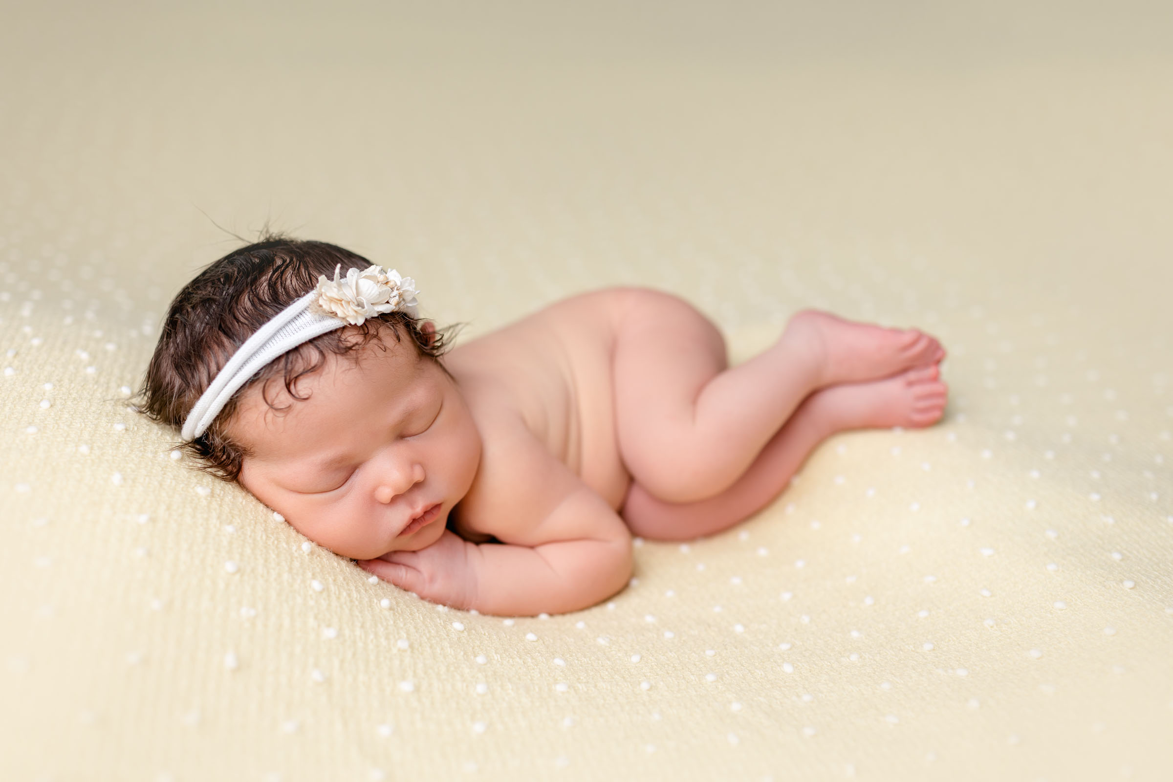 Side laying pose by San Diego Infant Photographer