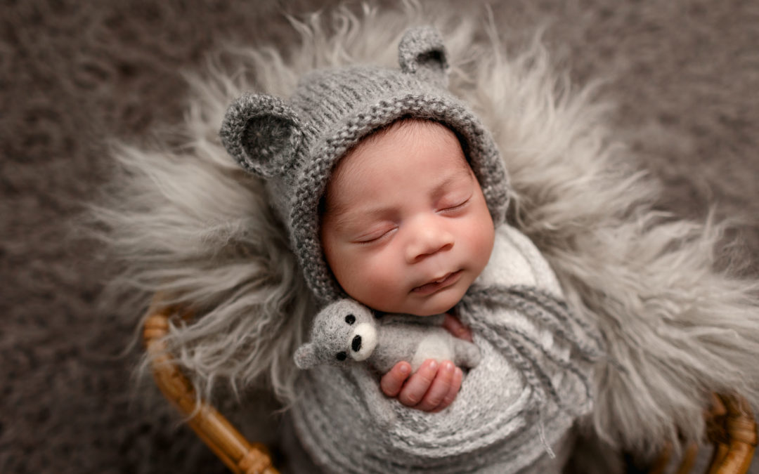 Banner image of newborn for blog post about 10 questions to ask your newborn photographer before hiring them for your newborn pictures