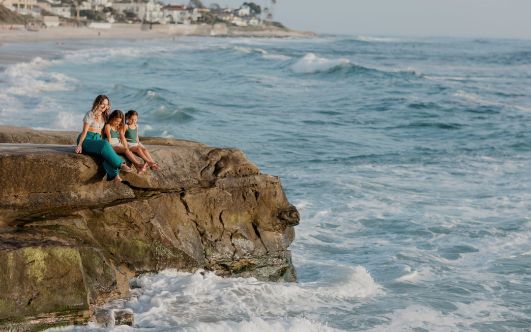 San Diego Mom Community and importance of having mom friends blog banner with image of mom and daughters by the ocean