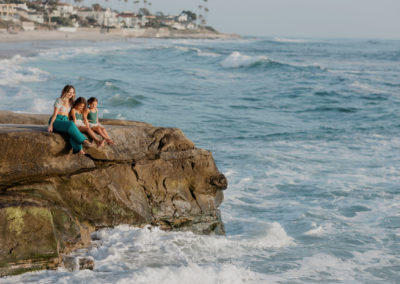 San Diego Mom Community and importance of having mom friends blog banner with image of mom and daughters by the ocean