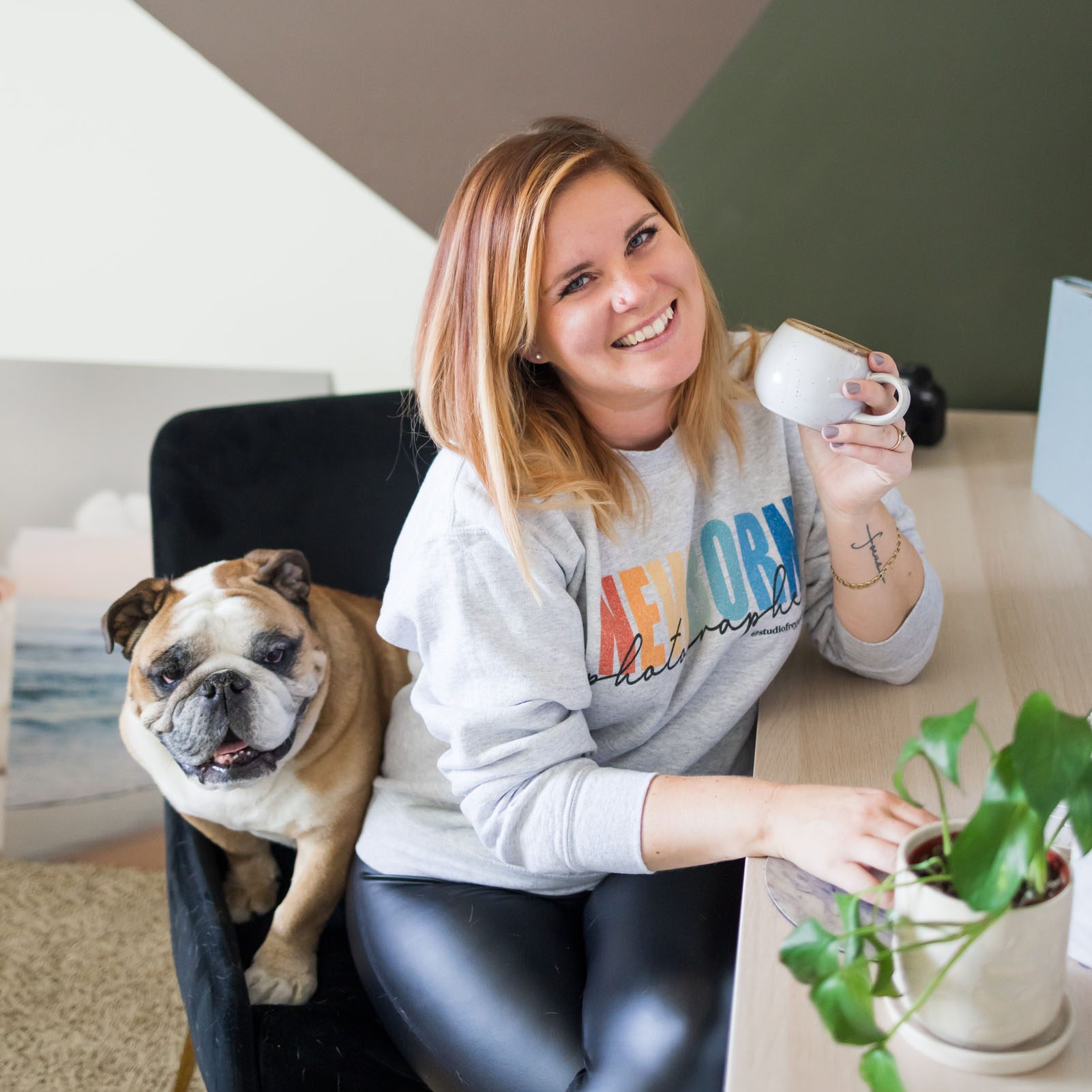 Headshot of San Diego Newborn Photographer sitting on a chair in her office with her English Bulldog
