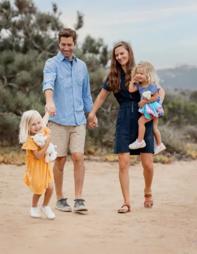 Family Portrait of family of 4 walking hand in hand during San Diego Family Pictures