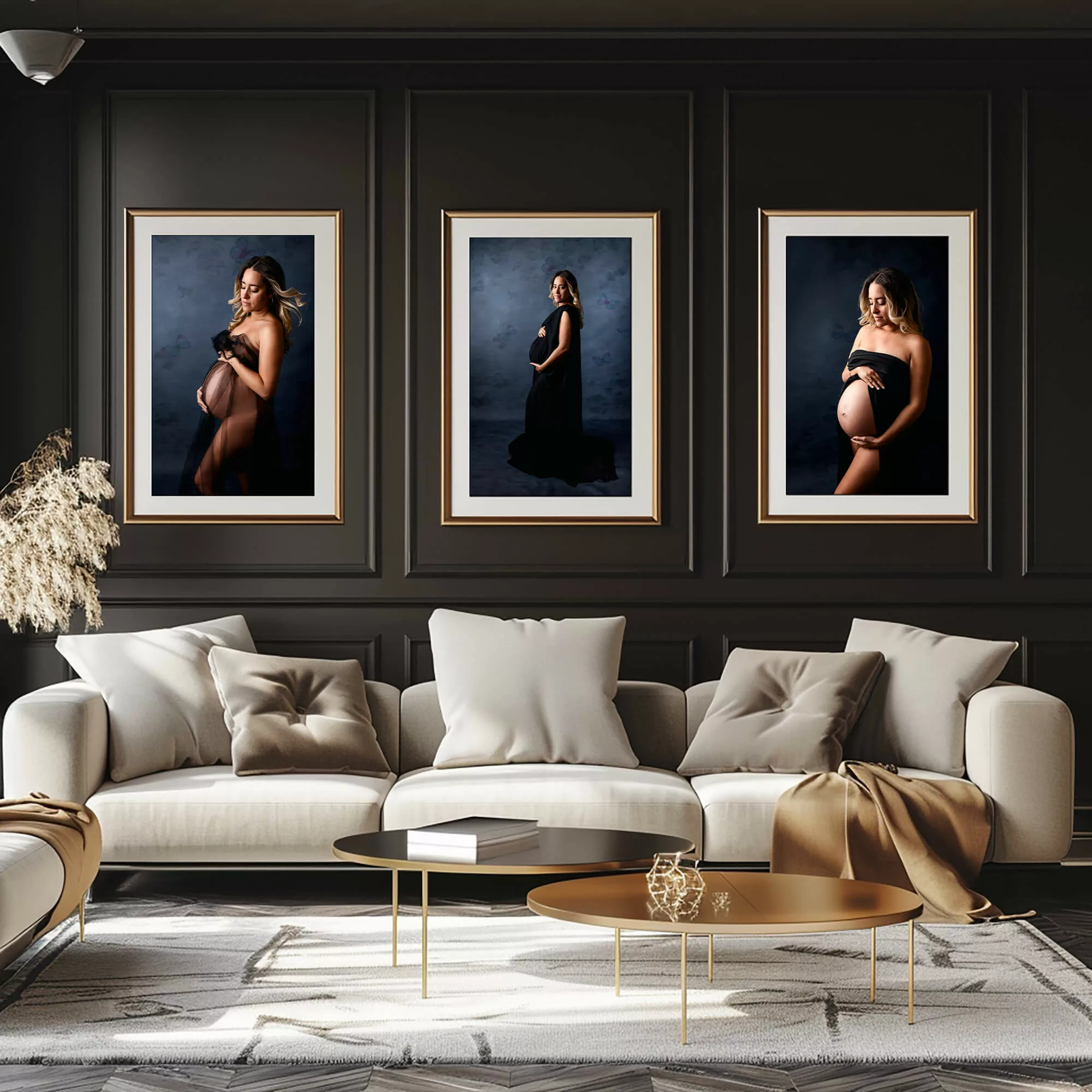 Luxurious living room setting featuring three framed maternity portraits, creating a cozy and inviting ambiance