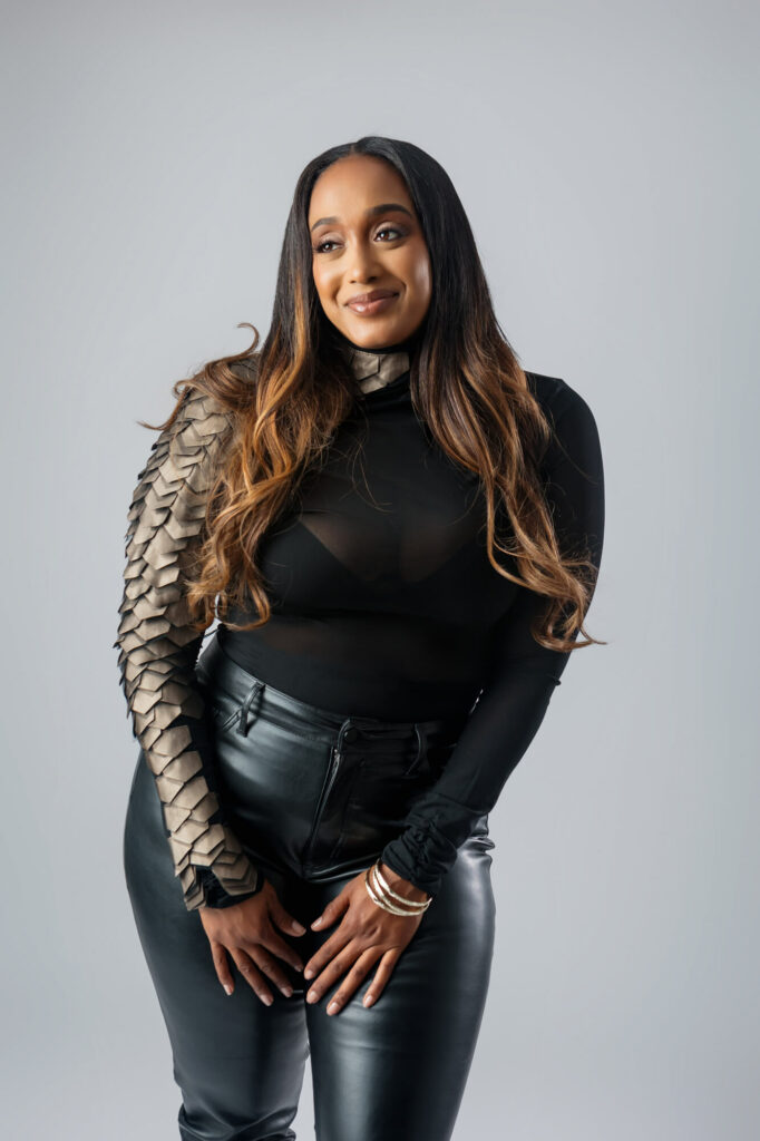 Professional portraits of a beautiful woman of color wearing a black outfit